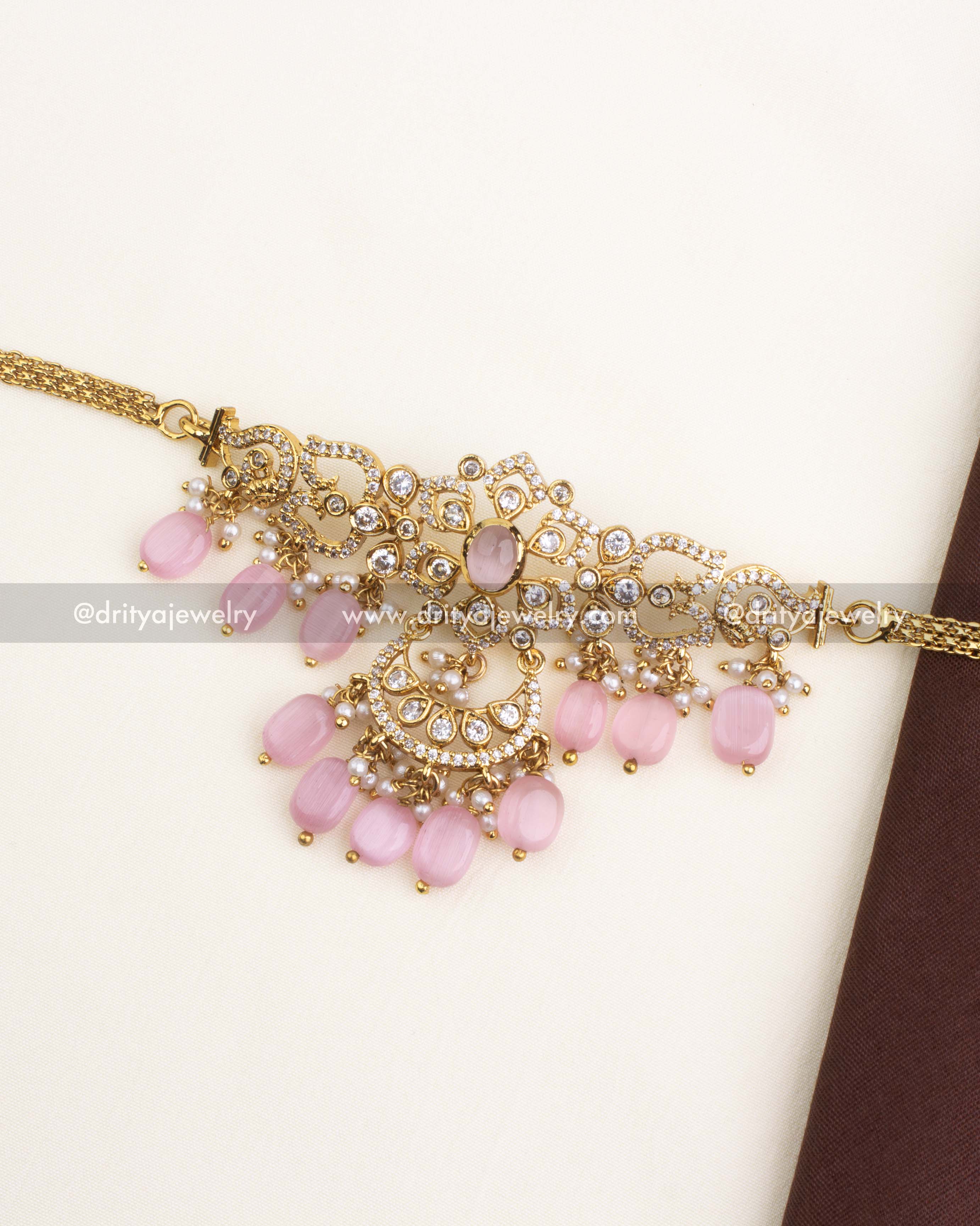 Gold-plated choker necklace with blush pink beads and CZ stones, paired with matching jhumkas.