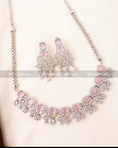 Necklace featuring blush pink rectangular stones and American diamonds in a rhodium setting.