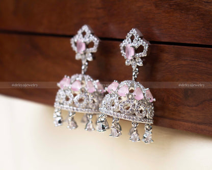 Blush pink zircon Jhumka earrings featuring intricate detailing and teardrop danglers.