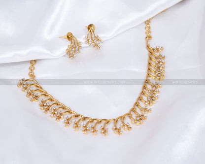 Elegant CZ Necklace Set in white stones with matching earrings, displayed on a white backdrop.