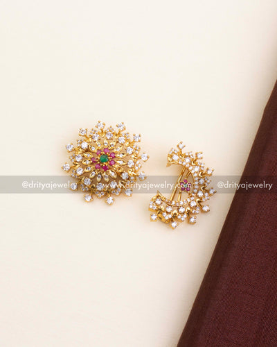Sun and moon-shaped gold hair accessories with CZ stones, emerald and ruby accents.
