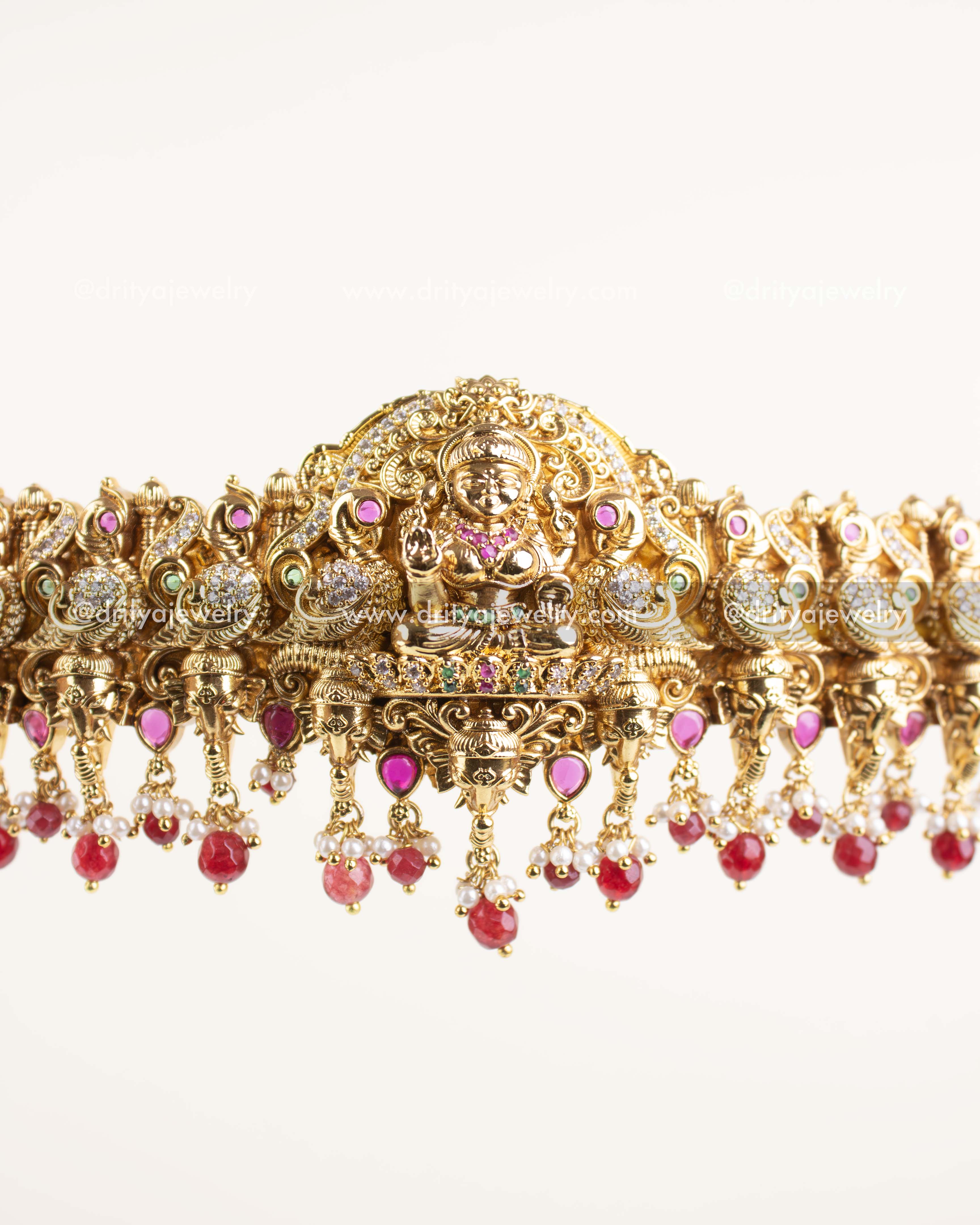 Close-up of ruby bead and pearl hangings.