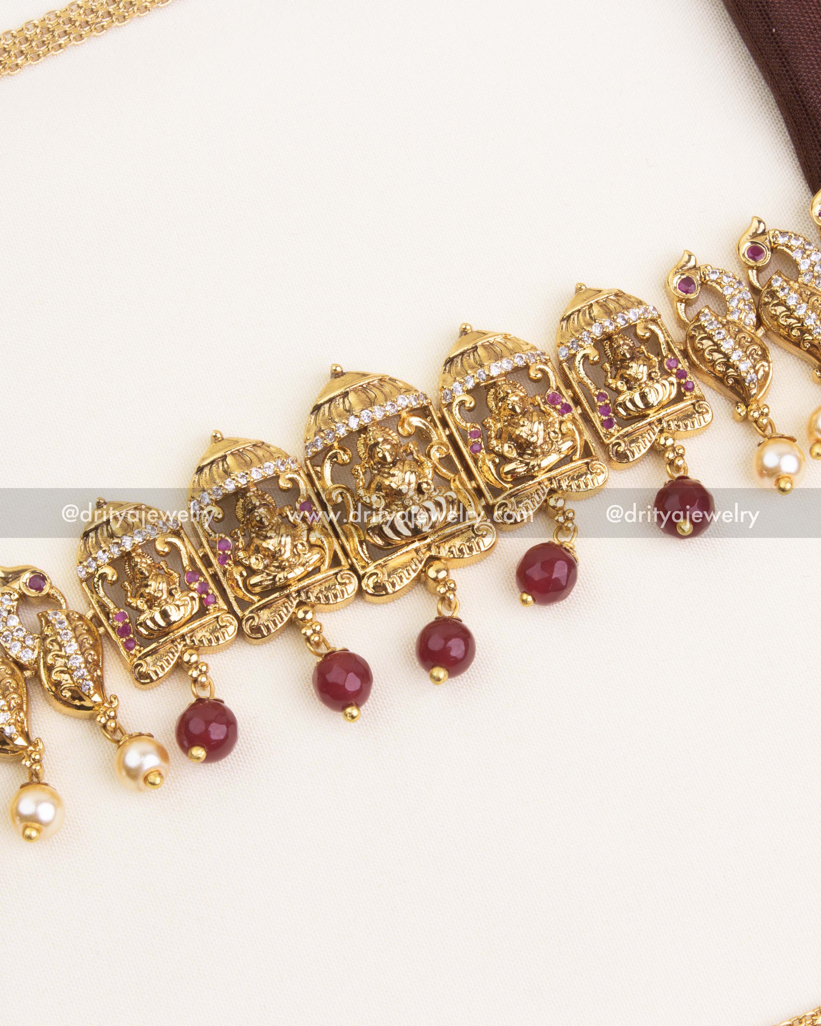 Detailed center design with ruby bead drops and goddess motif