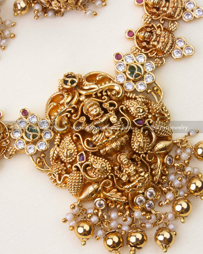 Close-up of Lakshmi motif temple necklace with antique gold polish and pearl hangings