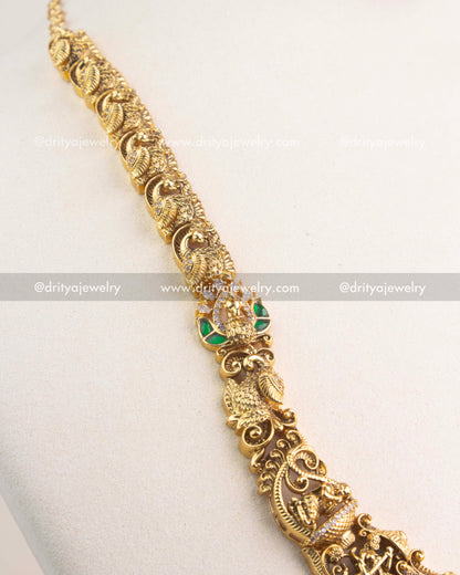 Handcrafted Nakshi chain with intricate carvings of peacocks and temple motifs.