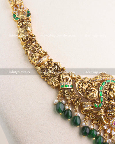 Handcrafted Nakshi chain with intricate carvings of peacocks and temple motifs.