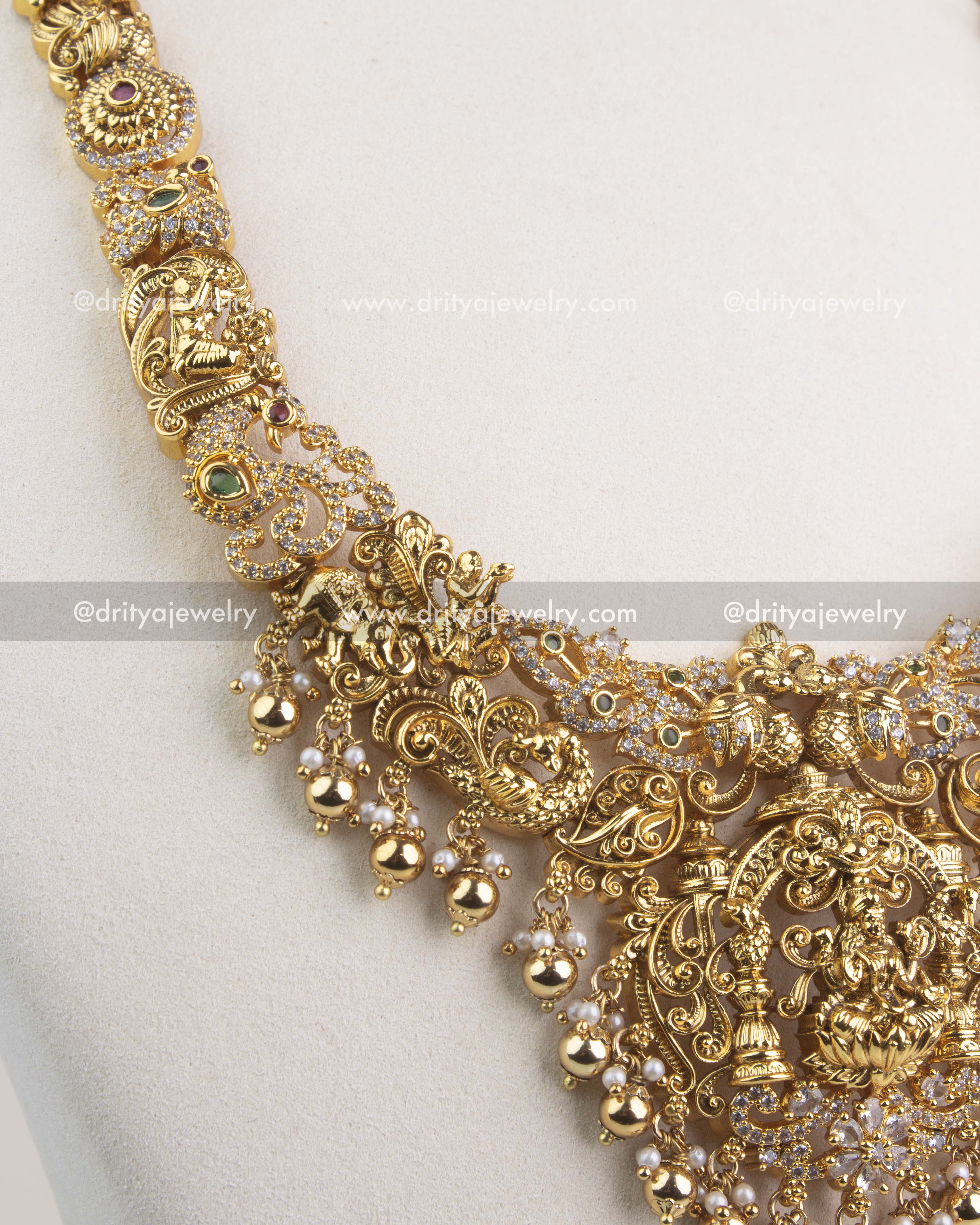 Handcrafted temple-style chain with deity and peacock motifs, accented with CZ stones.