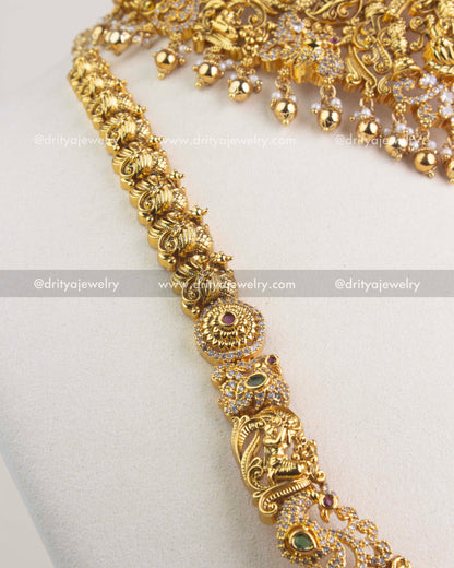 Handcrafted temple-style chain with deity and peacock motifs, accented with CZ stones.