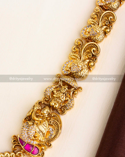 Intricately designed chain with peacock, goddess, and floral Nakshi carvings.