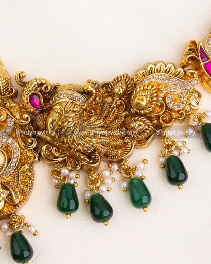 Intricately designed chain with peacock, goddess, and floral Nakshi carvings.