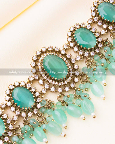 Pastel green choker with white crystal halos and delicate beadwork