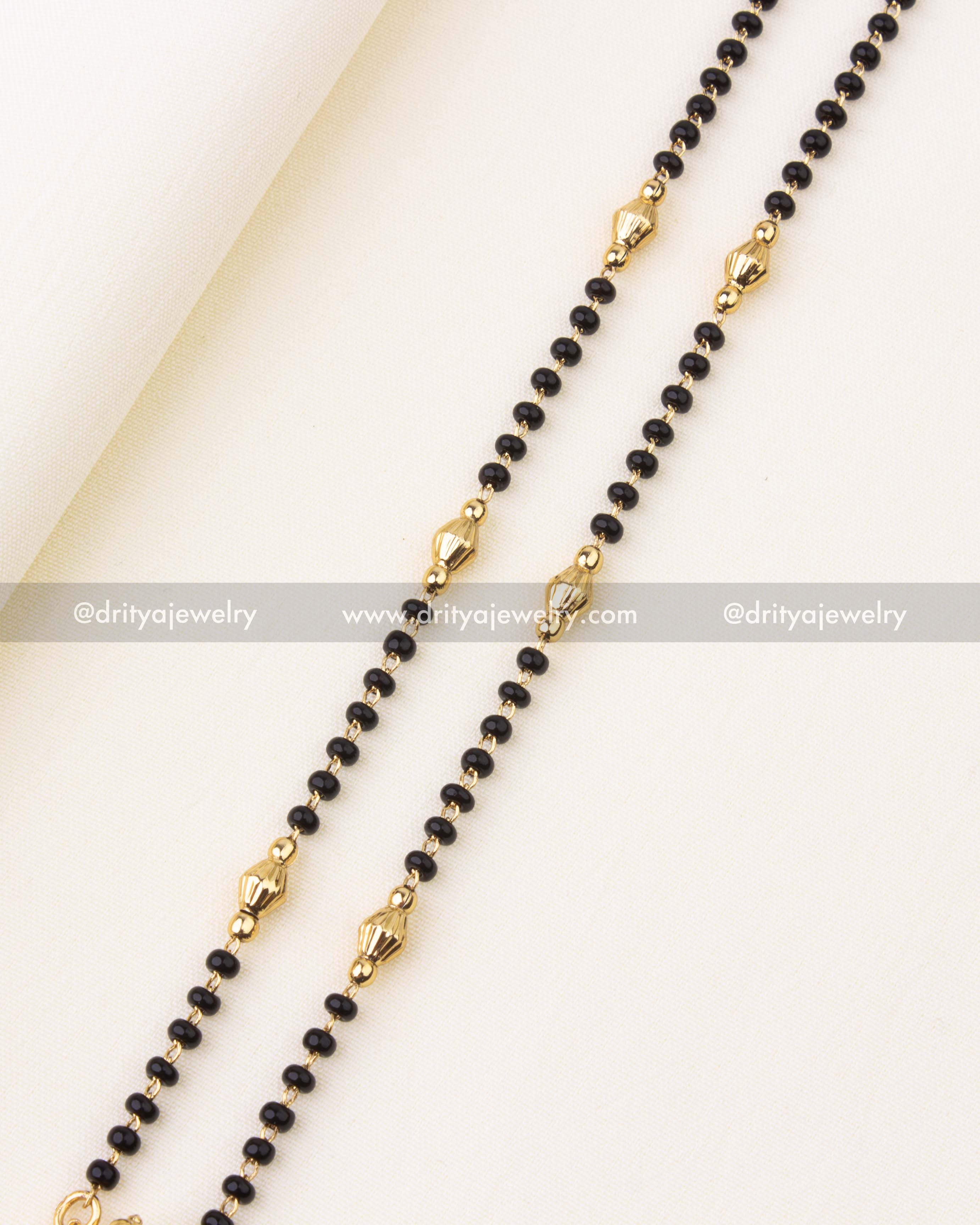 Intricate Venkateswara Swamy deity pendant with antique gold finish and pearl danglers.