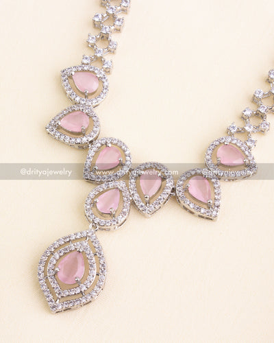 Teardrop blush pink stones set in AD halos on a rhodium-plated necklace