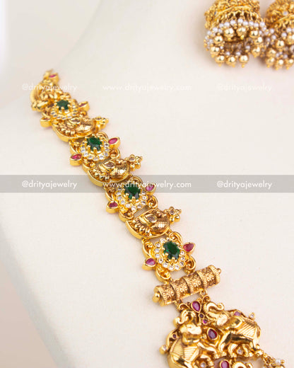 Detailed pendant design featuring Lakshmi, animal motifs, and CZ stone embellishments in antique polish.