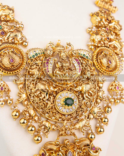 Detailed pendant design featuring Lakshmi, animal motifs, and CZ stone embellishments in antique polish.
