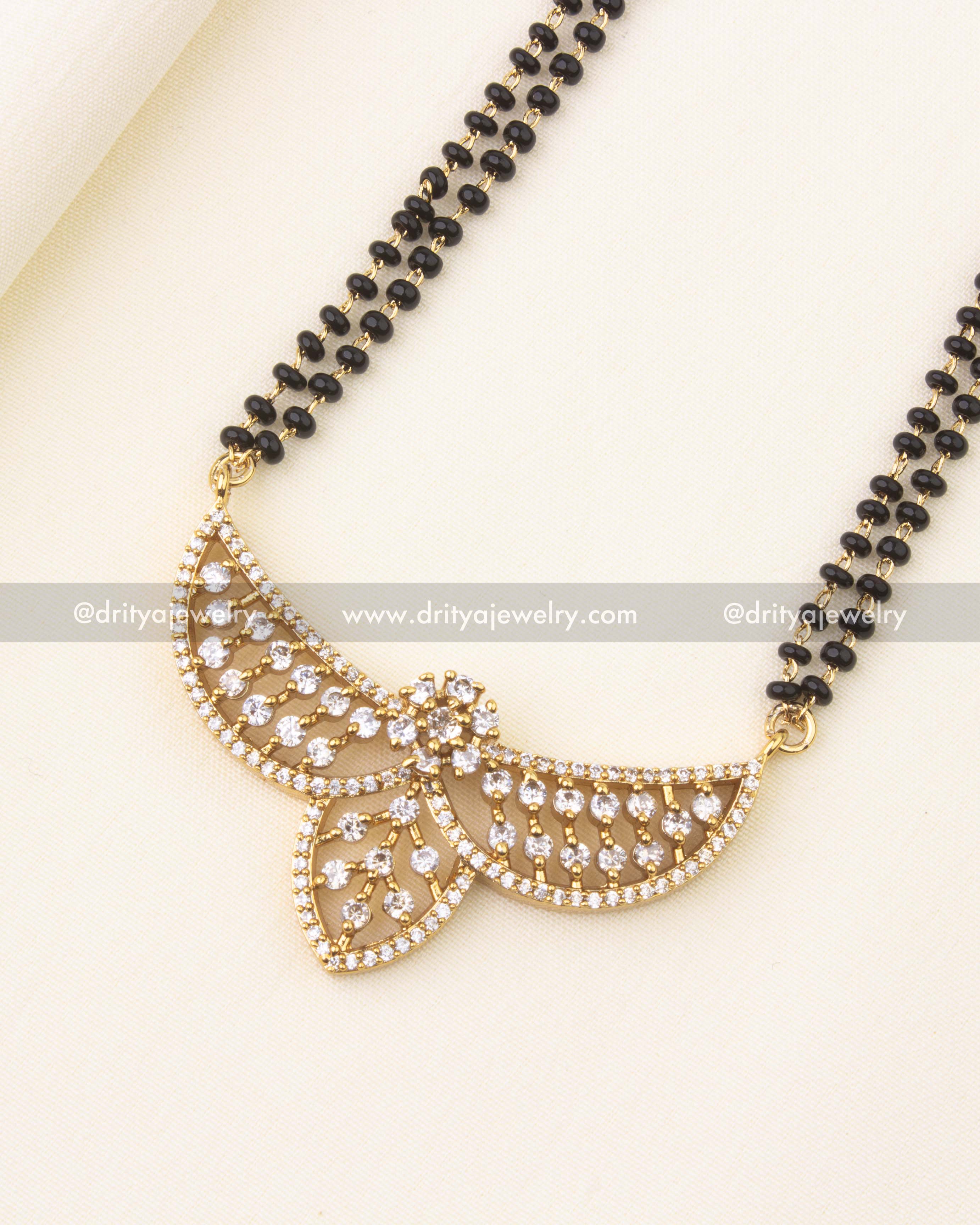 Designer pendant with sparkling CZ stones on a black beads chain.