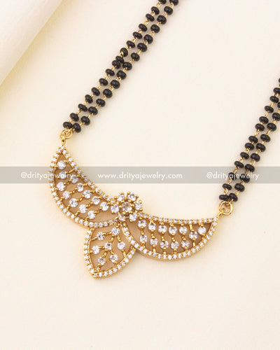 Designer pendant with sparkling CZ stones on a black beads chain.