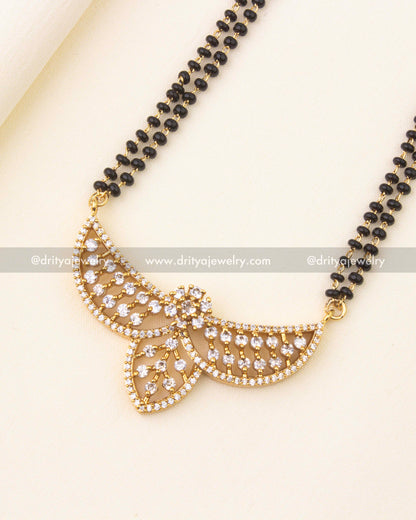 Designer pendant with sparkling CZ stones on a black beads chain.