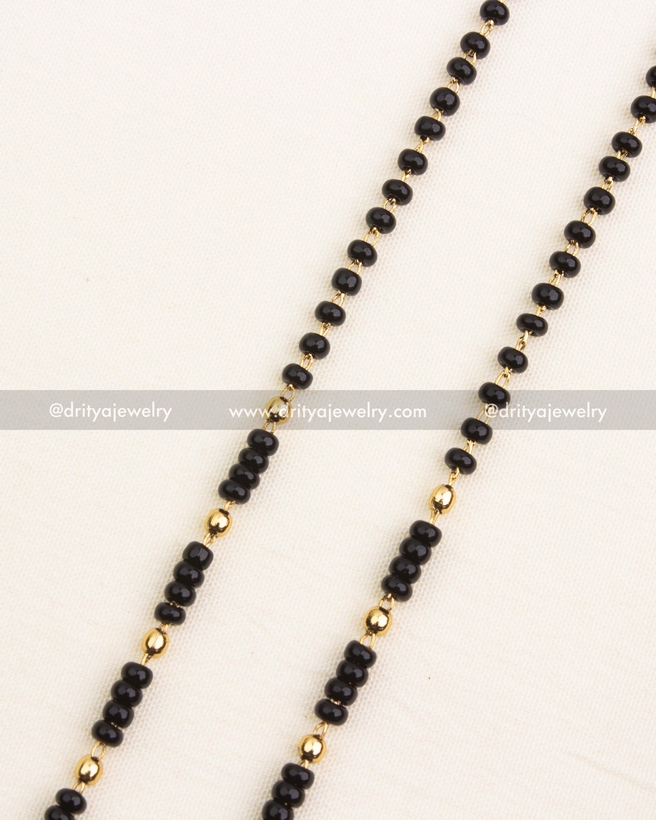 Premium single-line black beads necklace with antique temple pendant and pearl drops.