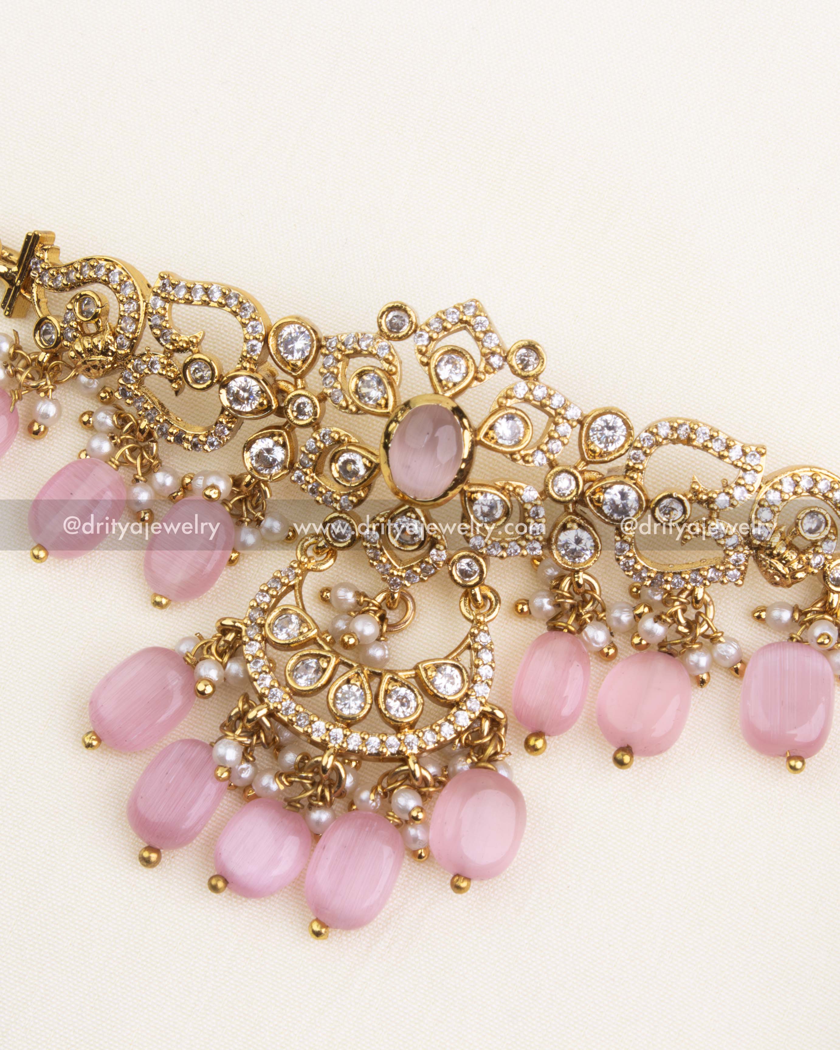 Detailed design of gold-plated choker with blush pink beads and CZ stones.