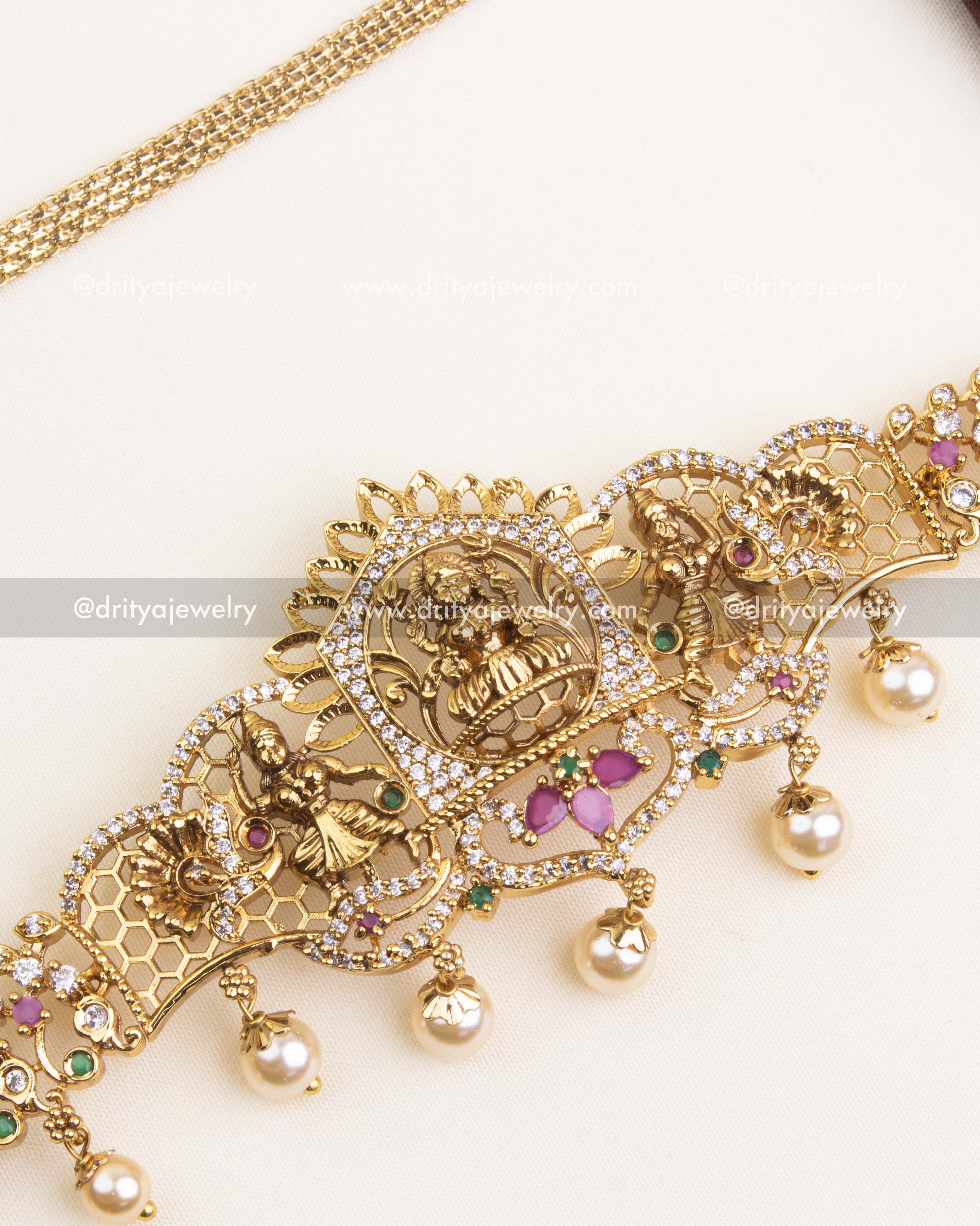 Detailed temple hip chain with pink and green accents, antique polish, and pearl hangings.