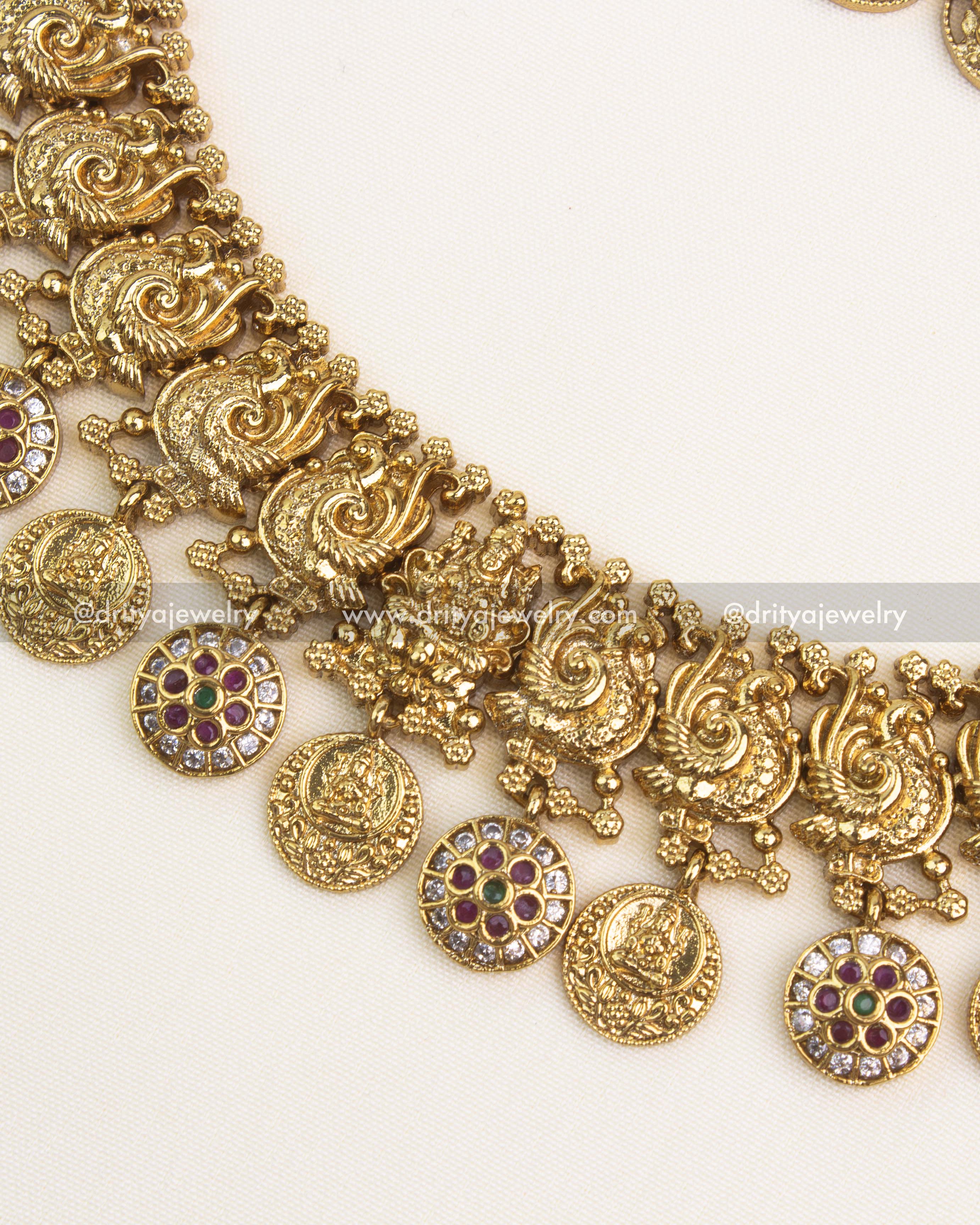 Handcrafted short necklace with peacock motifs and antique gold finish.