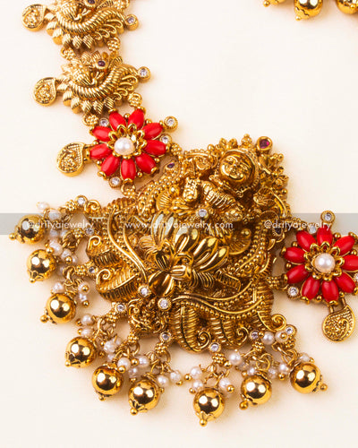 Intricate goddess Lakshmi pendant with coral bead flower and pearl accents