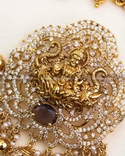 Detailed Lakshmi pendant with CZ stone accents, pearls, and intricate nakshi work.