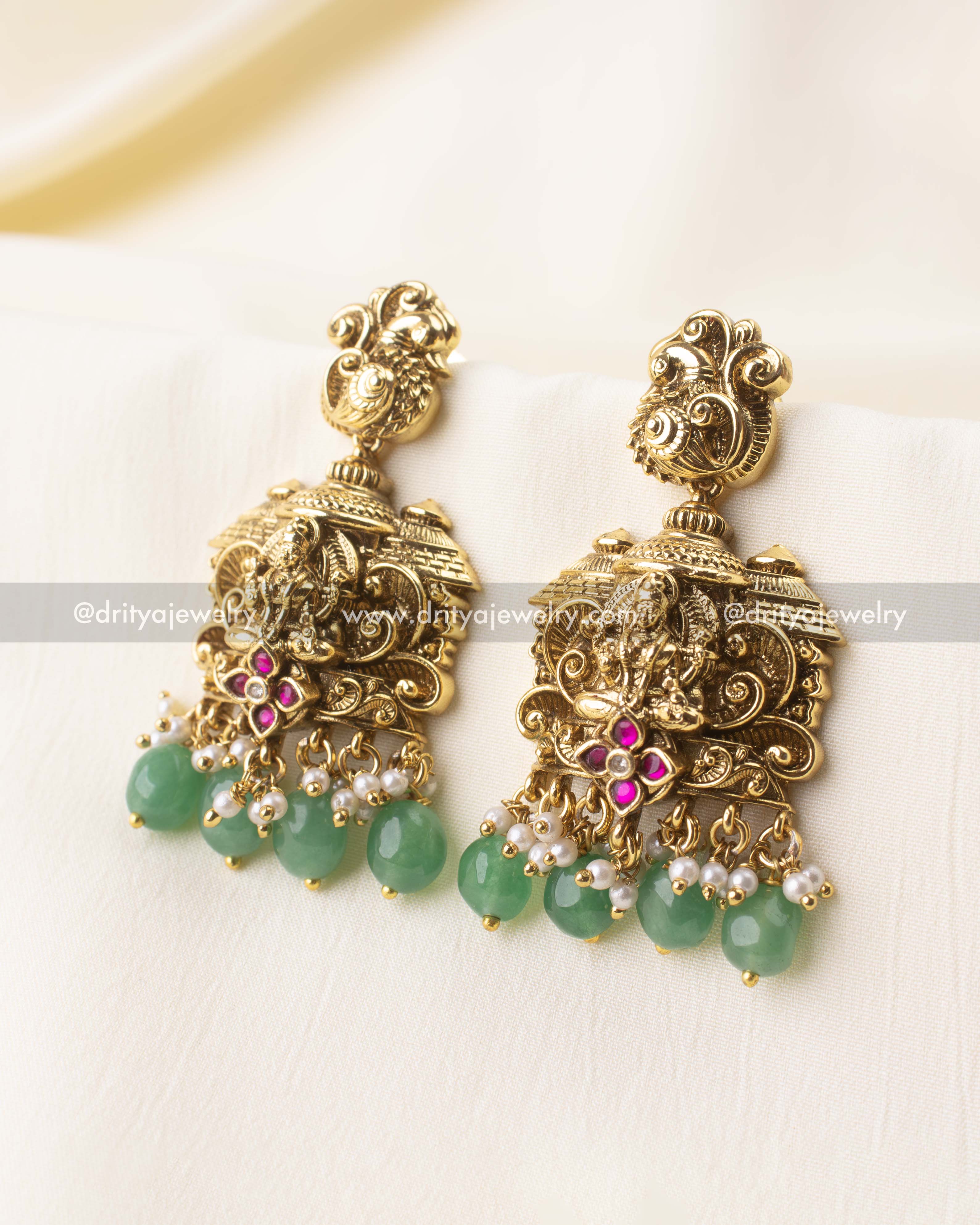 Handcrafted antique Lakshmi earrings with mint green bead drops and peacock top.