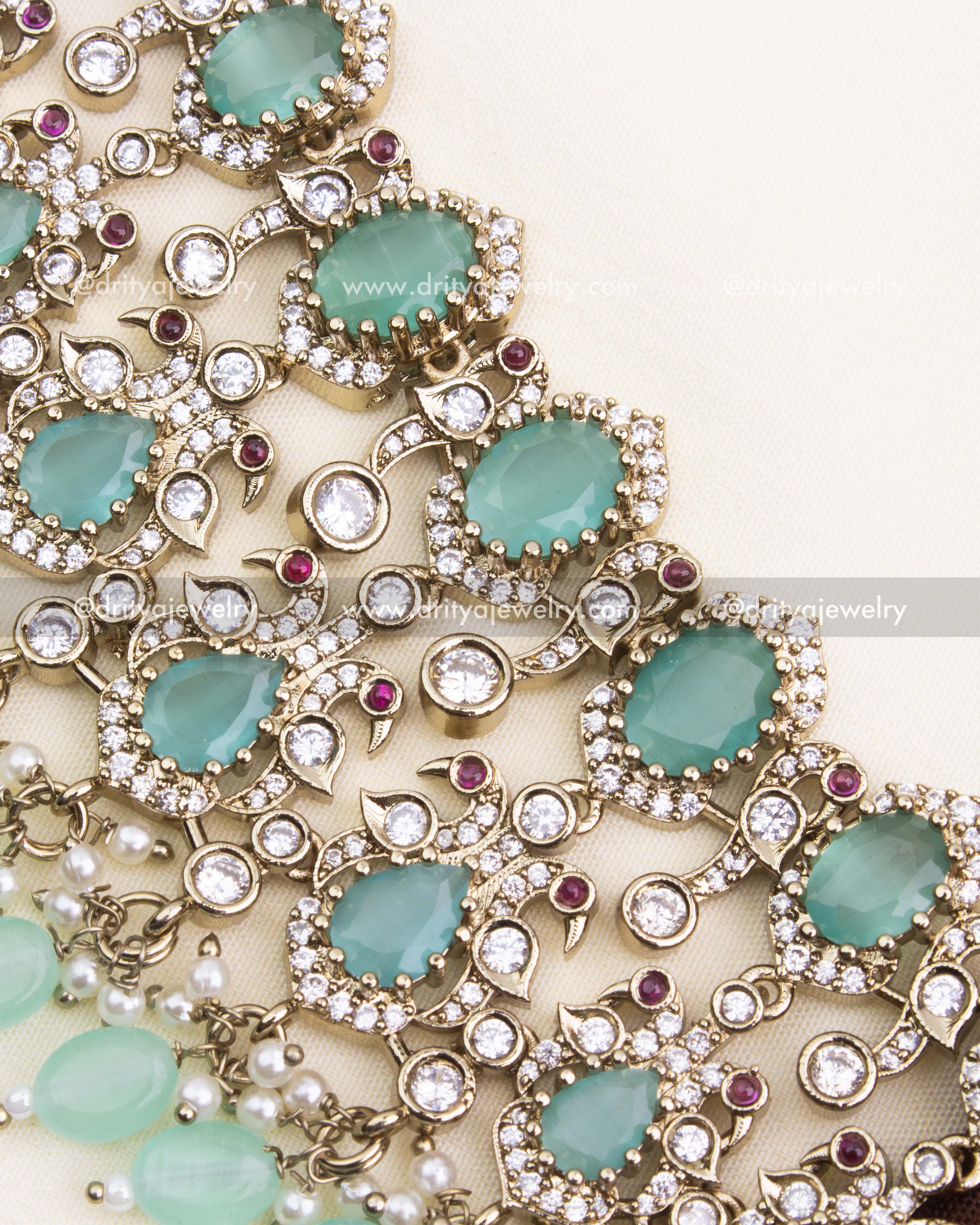 Detailed close-up of Victorian-style mint green choker with CZ stones and ruby accents.
