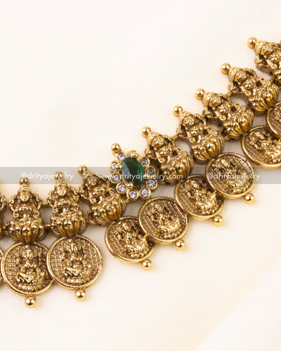 Detailed view showing embossed Lakshmi motifs and stone-studded floral connectors.
