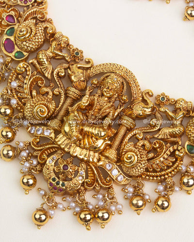 Peacock and floral Nakshi carvings with gold polish and embedded kemp stones.