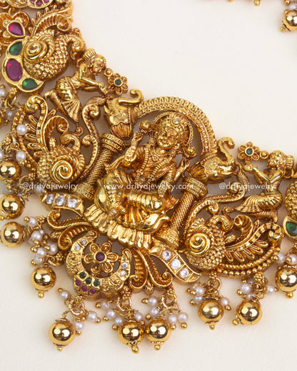 Peacock and floral Nakshi carvings with gold polish and embedded kemp stones.