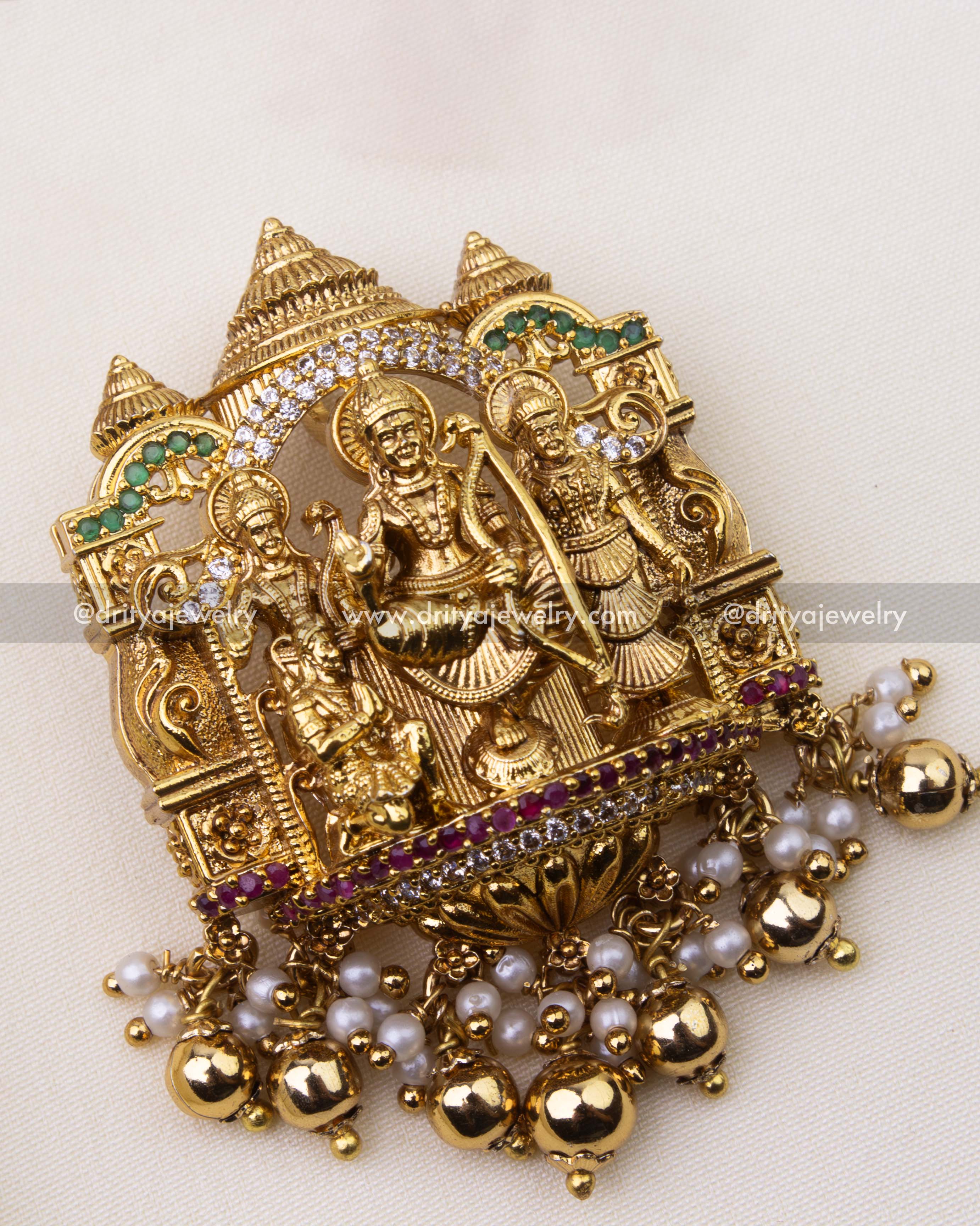 Detailed temple-style pendant featuring Ram, Sita, Lakshman, and Hanuman with ruby, CZ, and pearl embellishments.