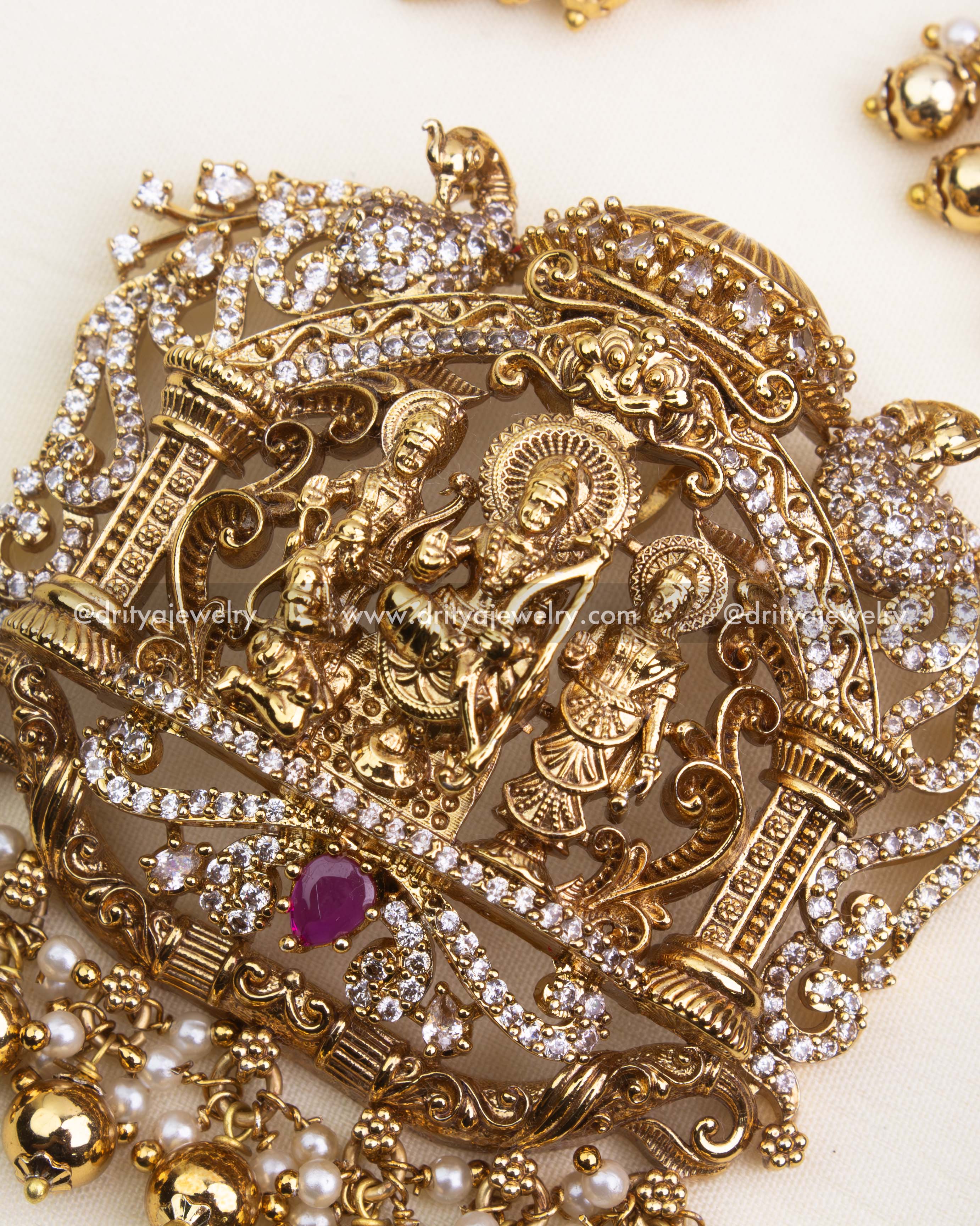 Intricately carved Ram Parivar pendant with Nakshi detailing, CZ stones, and bead hangings.