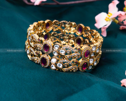 Detailed view of the Royal Gemstone Bangle Set showcasing the intricate filigree and gemstone setting.