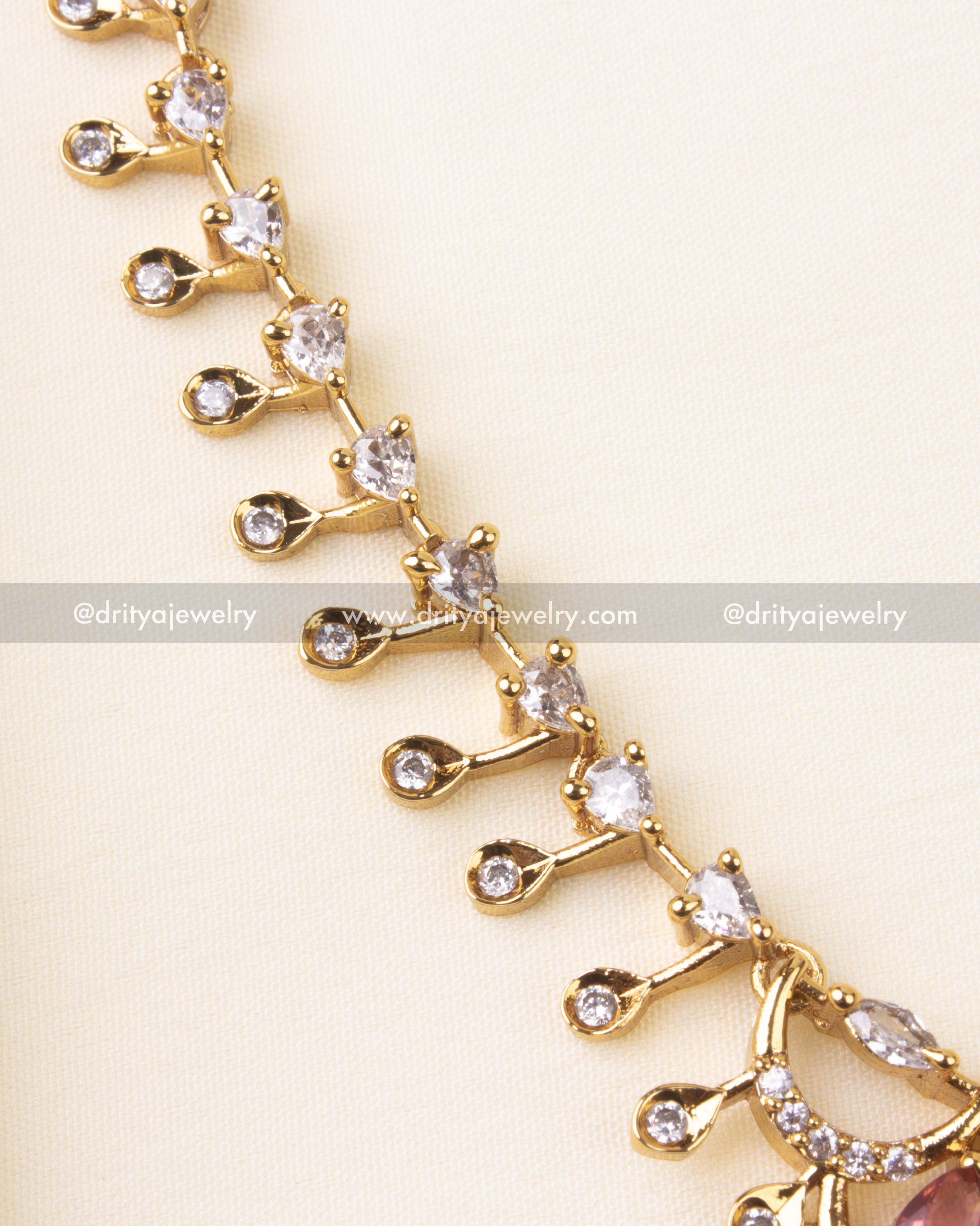 Detailed center view of ruby red stone and CZ arrangement in fixed design