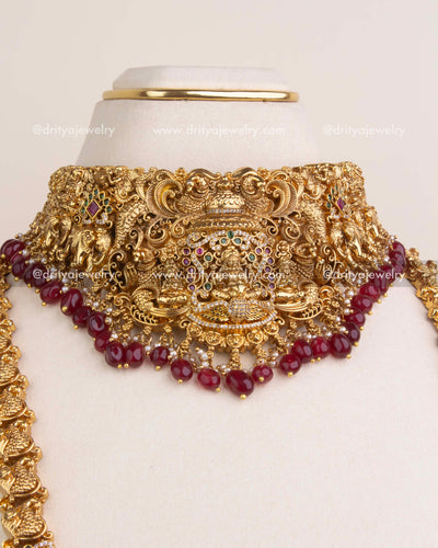 Lakshmi pendant with ruby red bead borders and multicolor CZ embellishments.