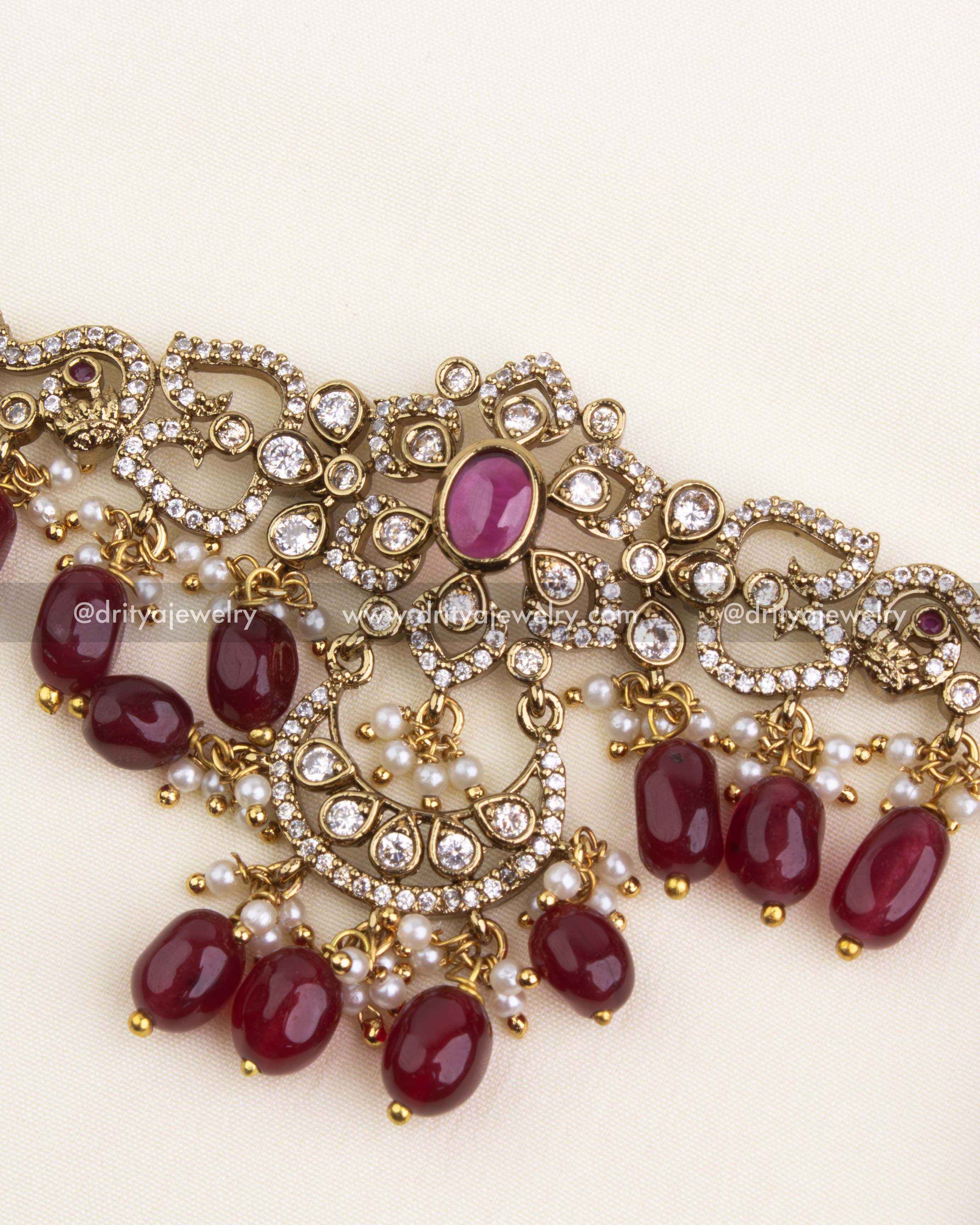 Detailed Victorian-style choker set in ruby red with CZ stones and floral motifs.