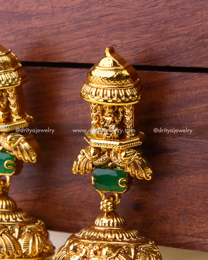 Detailed temple-style stud with Goddess Lakshmi motif and green stone connector.