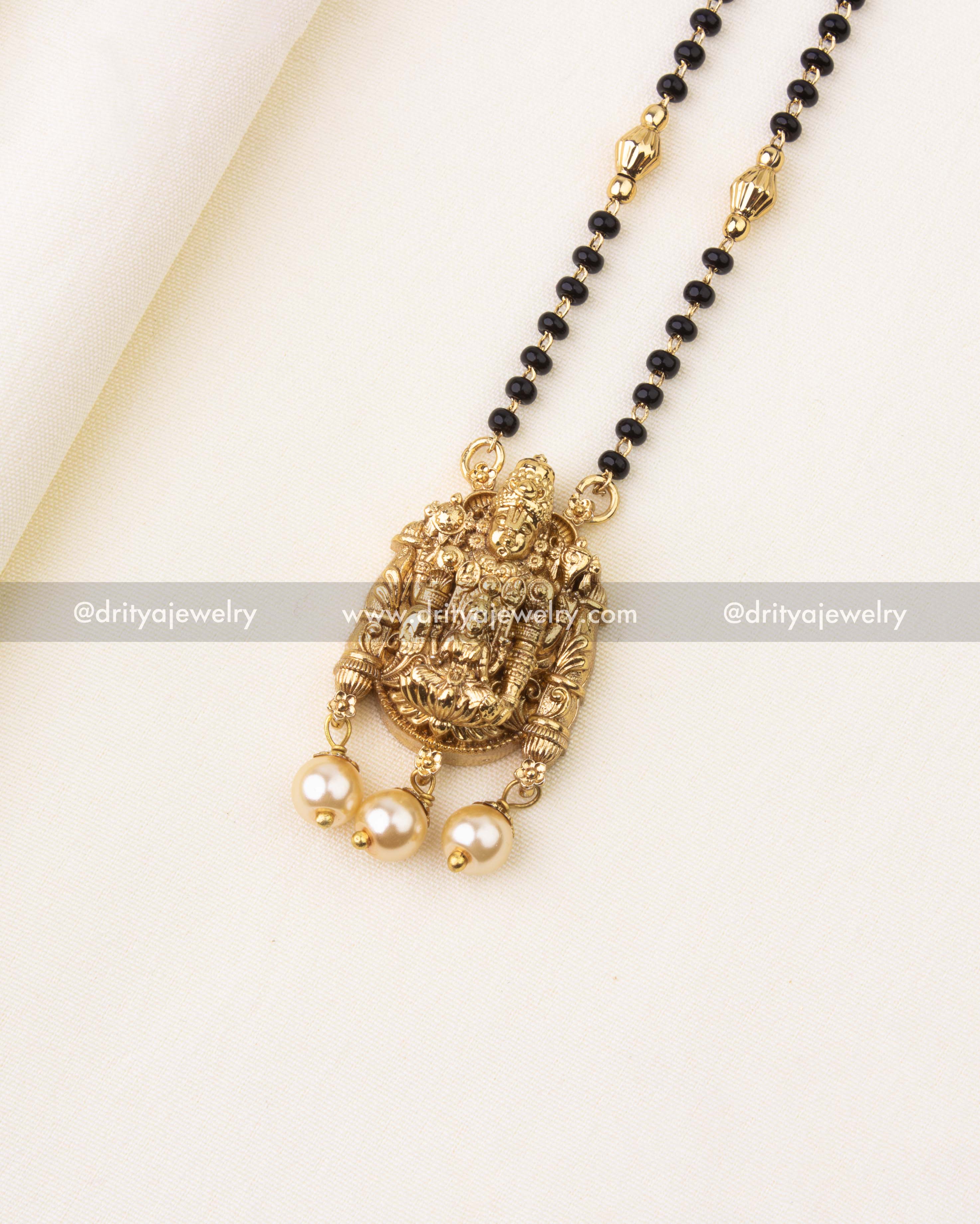 Detailed dual-strand black beads chain with golden spacers for mangalsutra necklace.