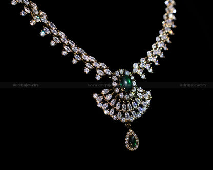 Close-up view of the Victorian Necklace Set by Dritya Jewelry featuring a green gemstone centerpiece and marquise-cut CZ stones.