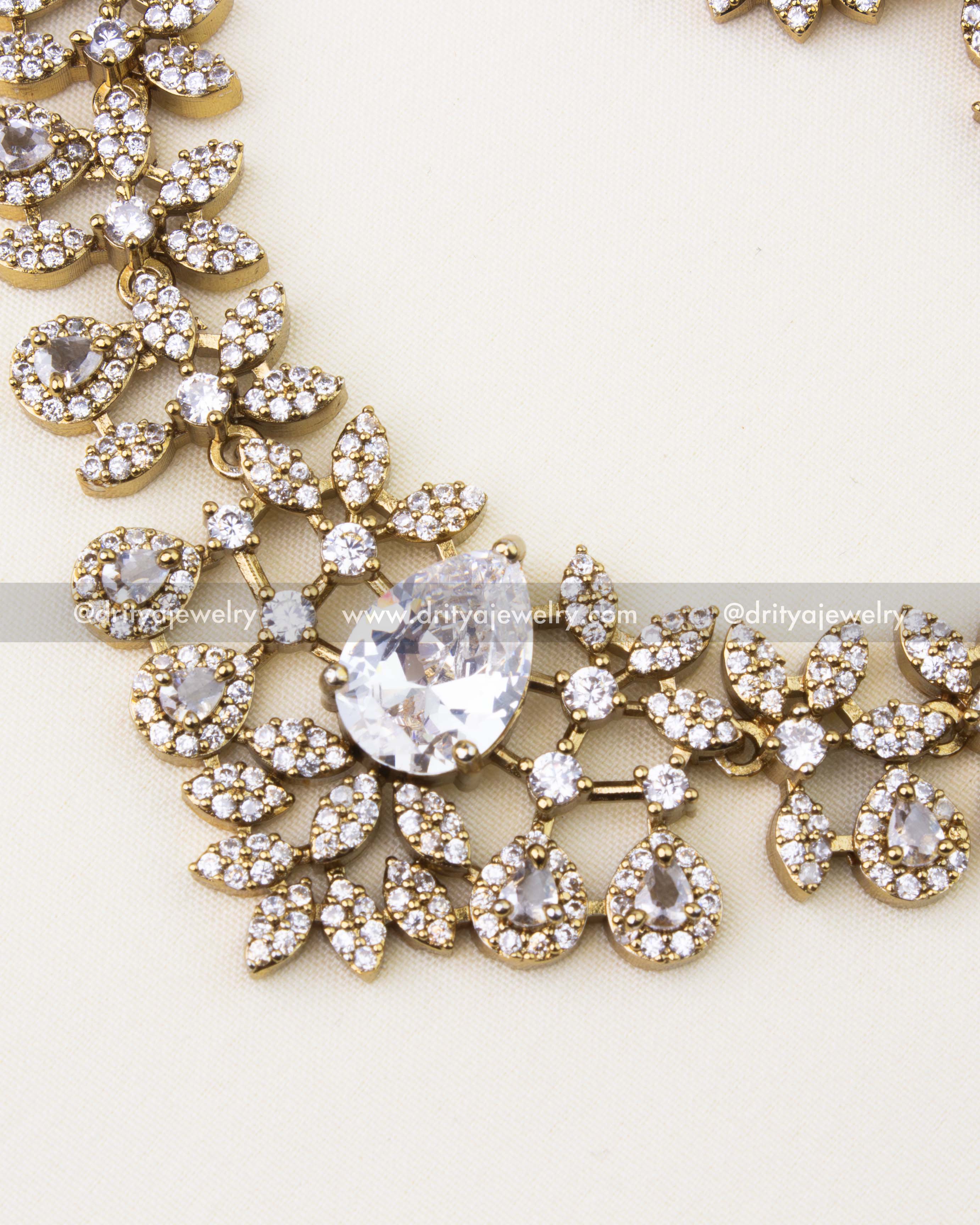 Detailed close-up showing pear-cut CZ stones and floral motifs in Victorian necklace.