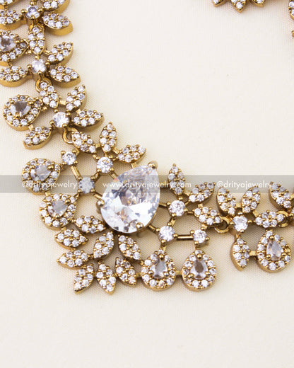 Detailed close-up showing pear-cut CZ stones and floral motifs in Victorian necklace.