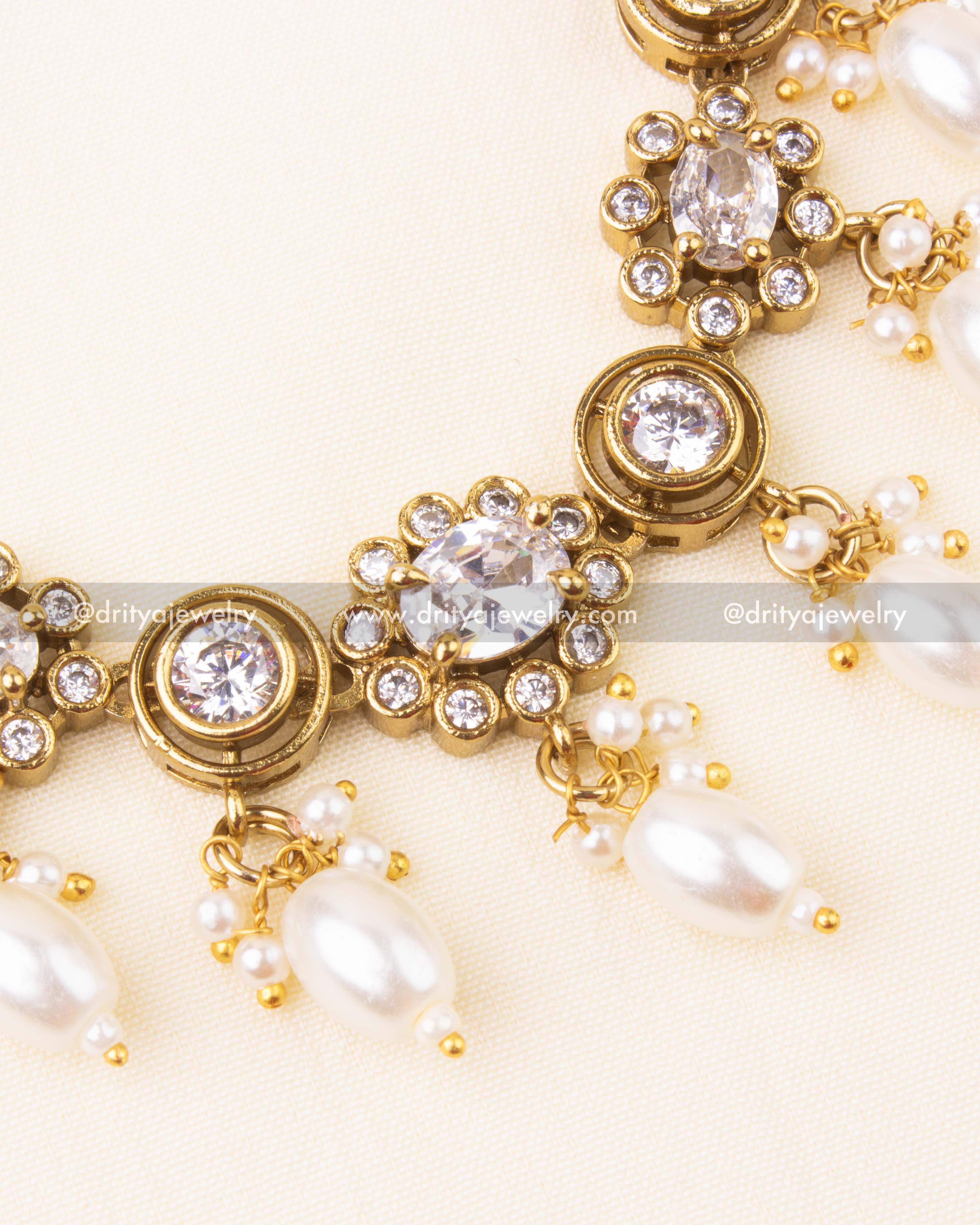 Detailed view showing white pearl beads and CZ stones on Victorian necklace.
