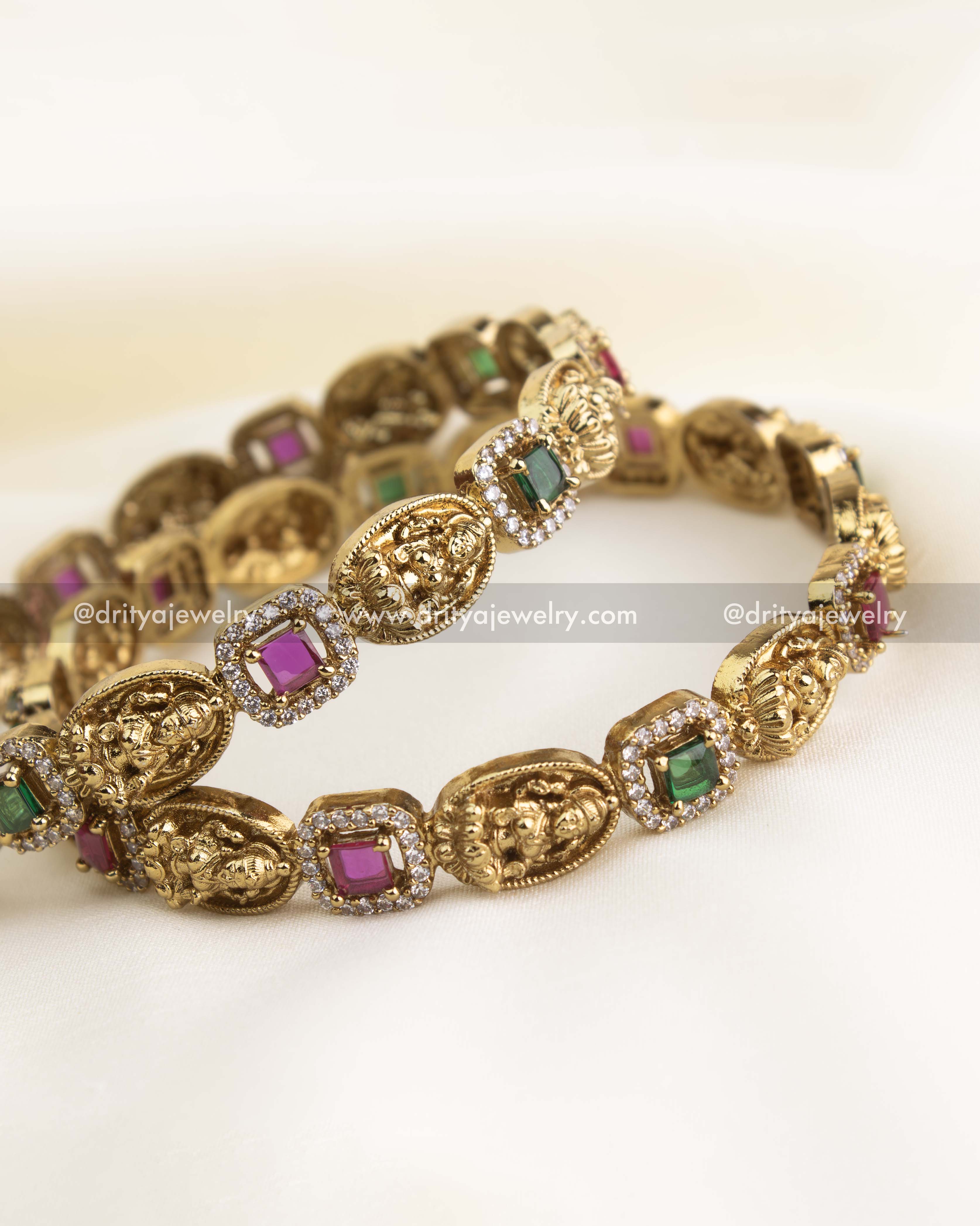 Macro view of sculpted Lakshmi oval with granulated borders and pavé CZ frame.