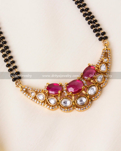 Intricate craftsmanship of ruby moissanite pendant with kundan and cubic zirconia accents.