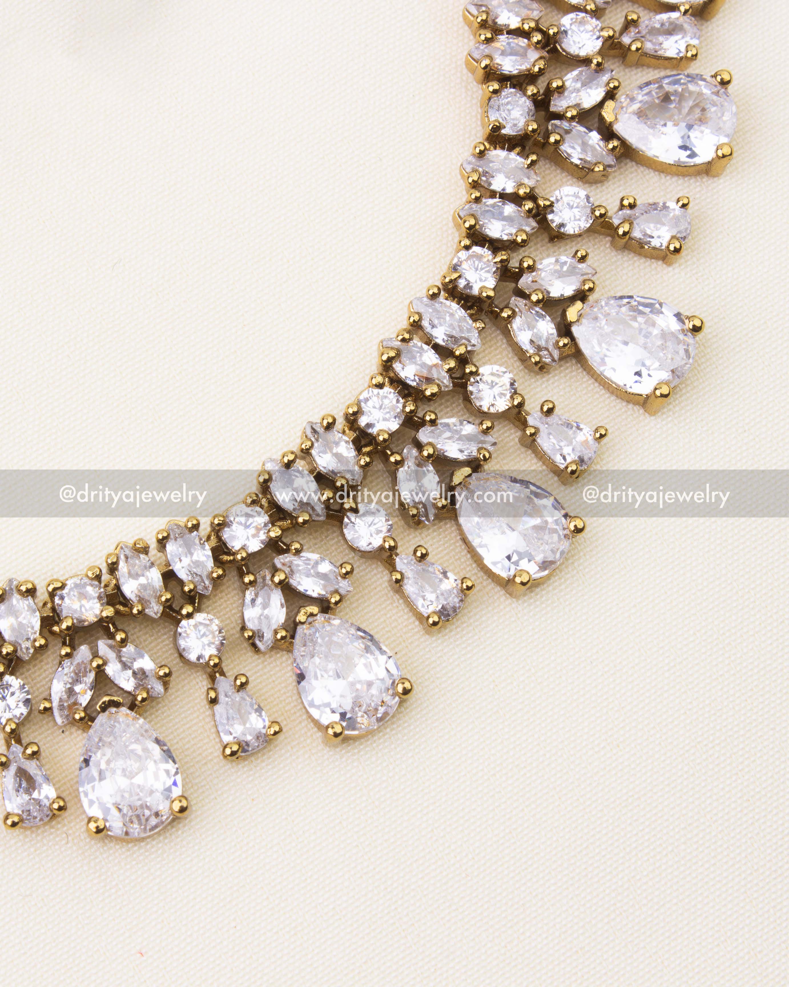 Close-up of necklace showcasing pear and round CZ stones