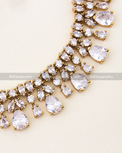 Close-up of necklace showcasing pear and round CZ stones