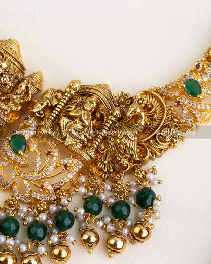 Side angle showing peacock inlays, stone-studded vines, and intricate nakshi work.